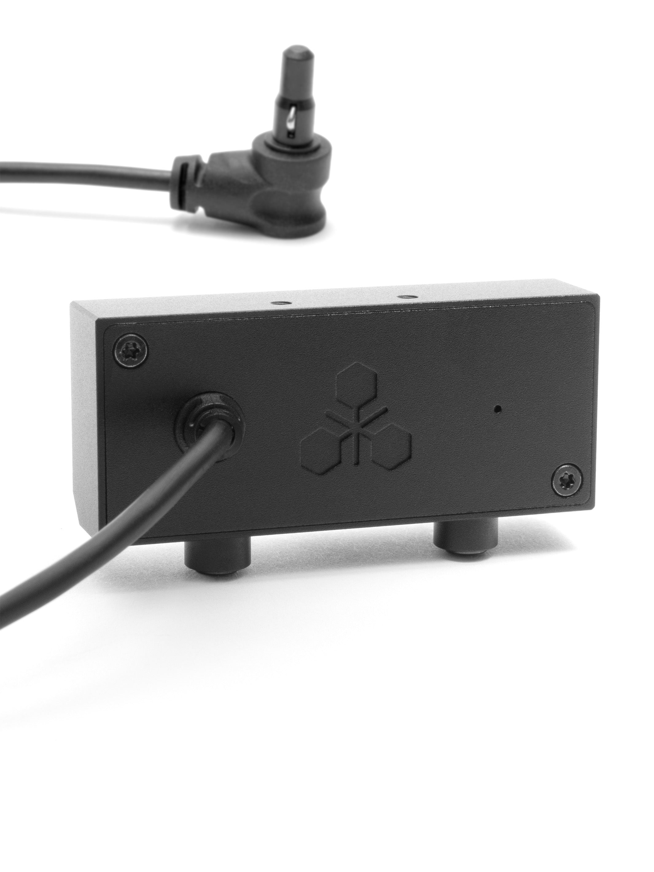 Back of the PEQ box showing the cable and right-angle plug that powers the StatTrak counter