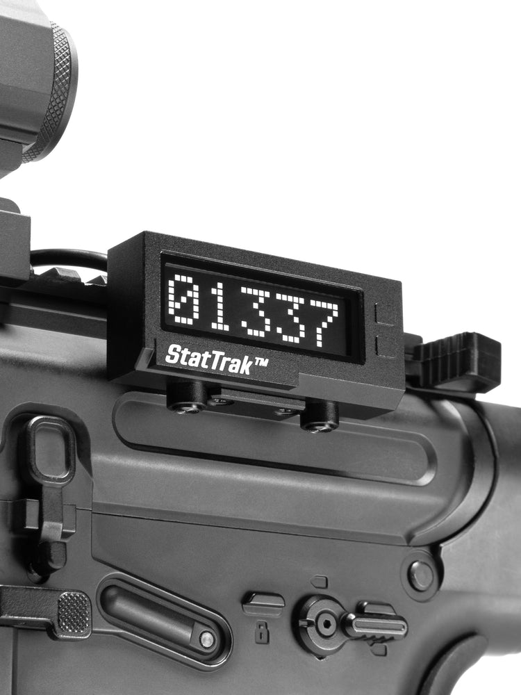 Close-up of real life StatTrak kill counter mounted on M4 type airsoft replica.