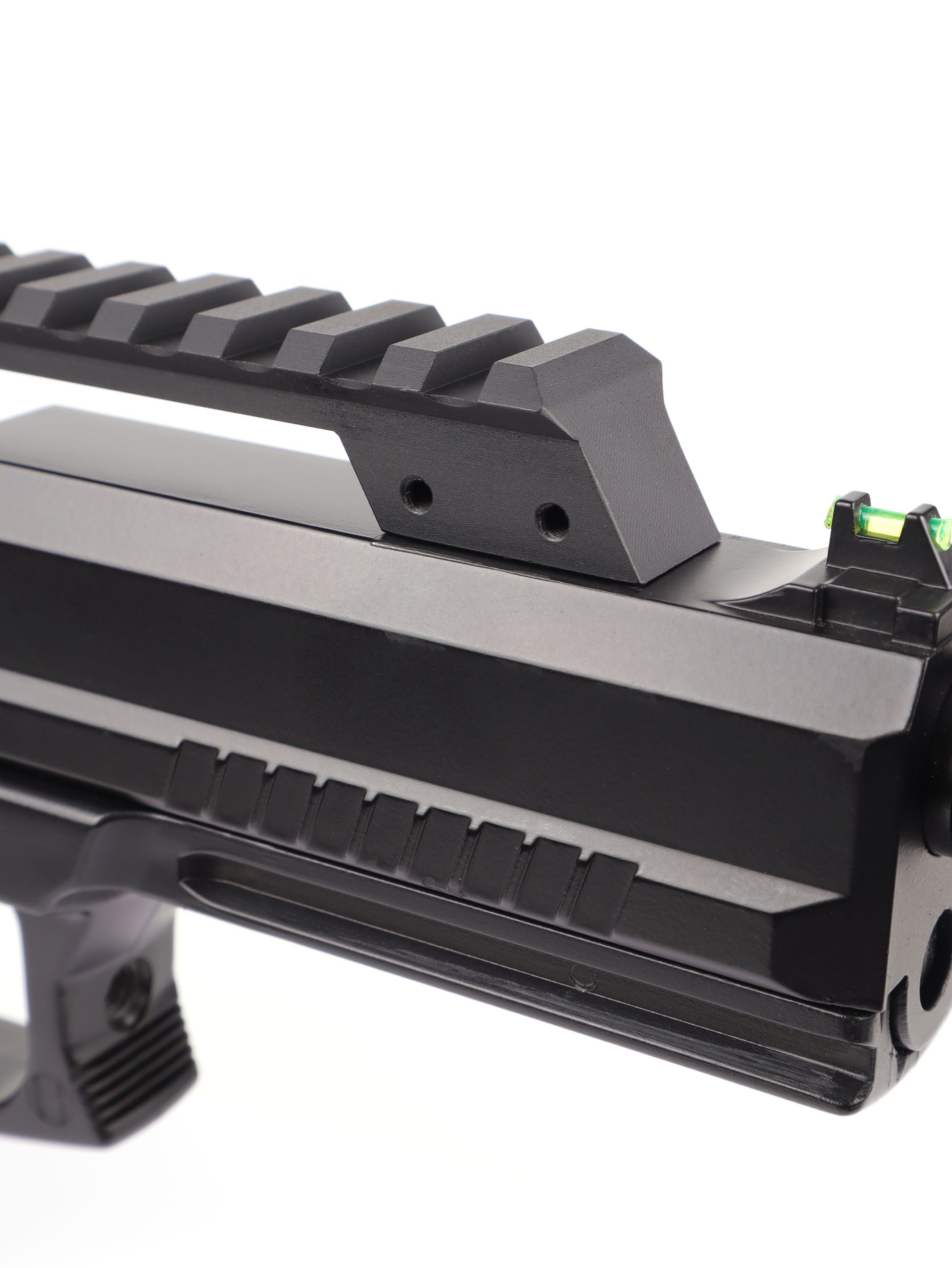 Rear of the long picatinny rail riser bridging the slide, front mounting holes visible