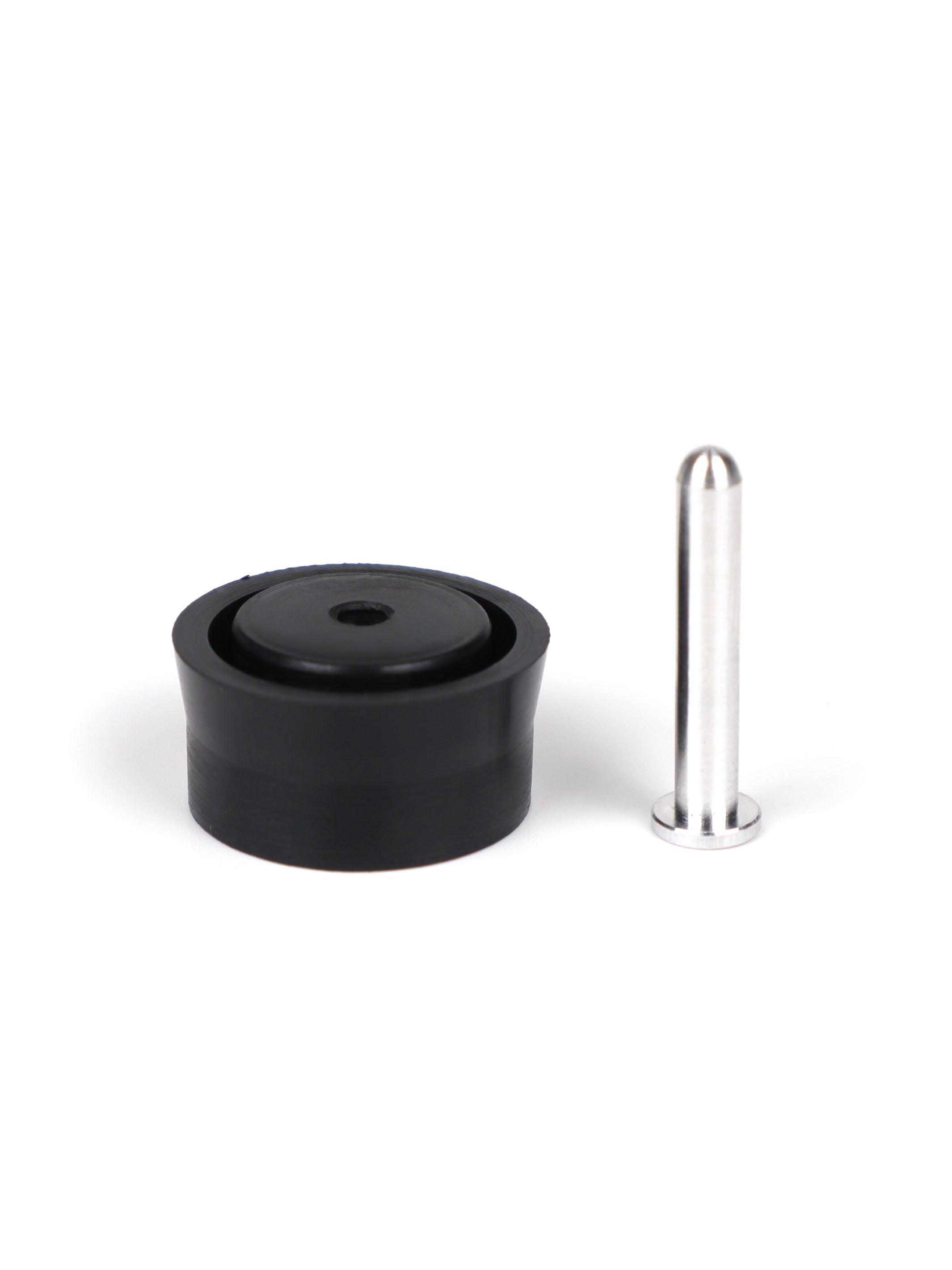 Single aluminum airbrake pin standing next to the black Modify piston head for the SSG96