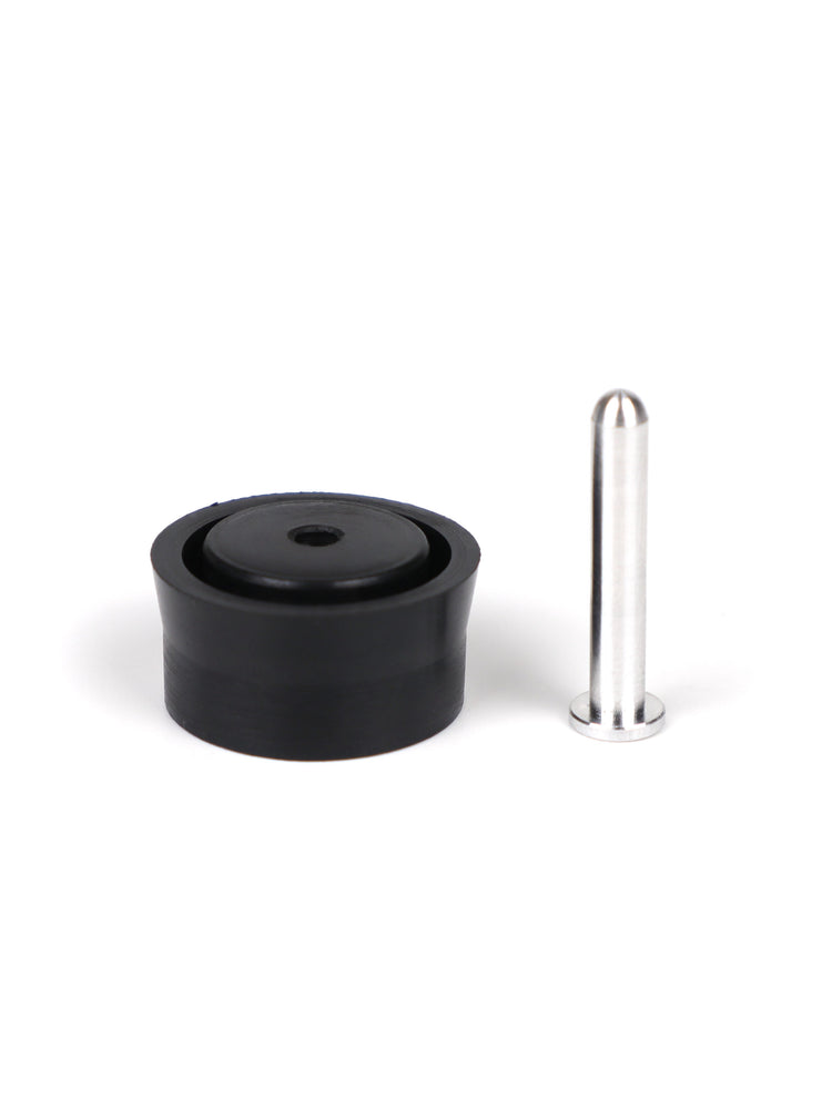 Single aluminum airbrake pin standing next to the black Modify piston head for the SSG96