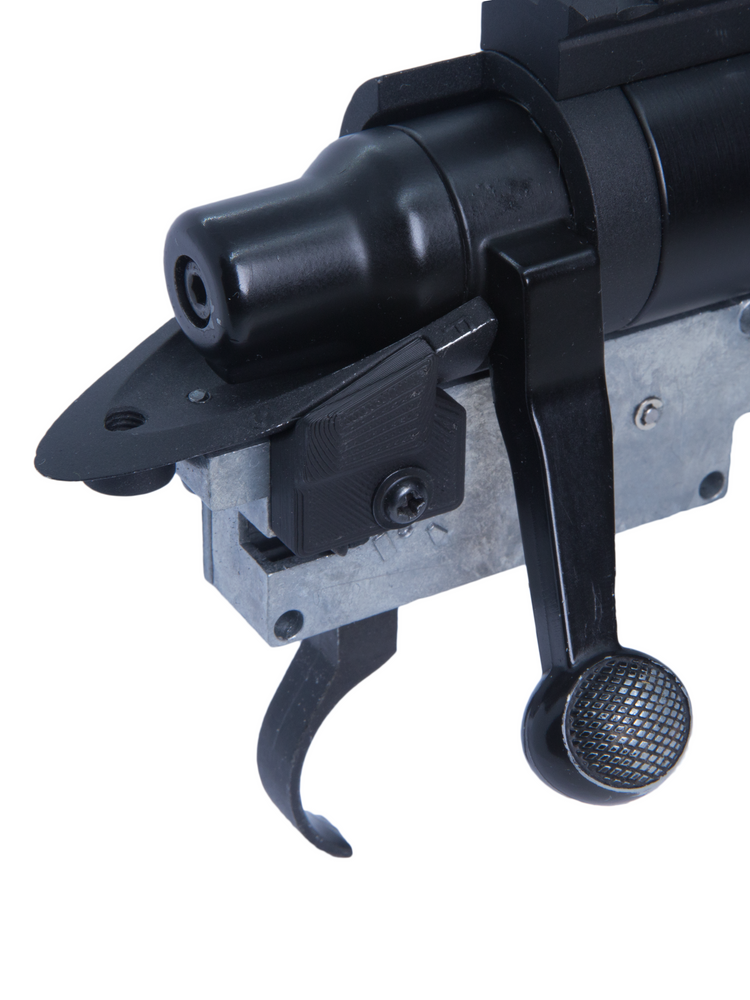 Close-up of the gun dust cover seated on the SSG24 trigger box above the trigger