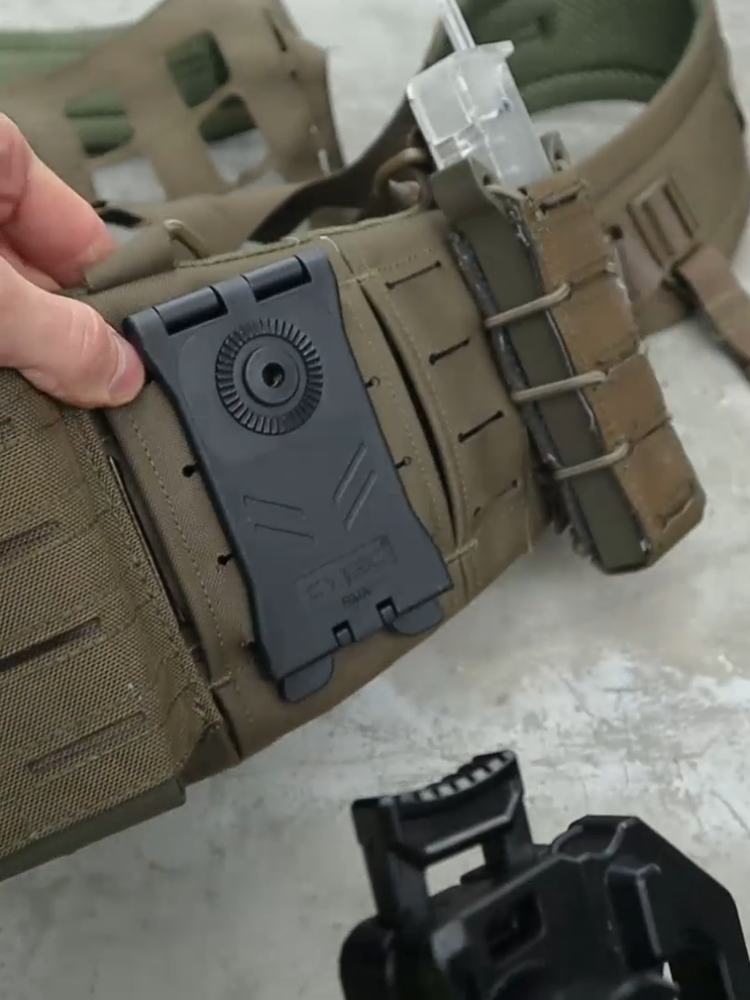 Video preview of the molle holster adapter mounted on a battle belt with mag pouches